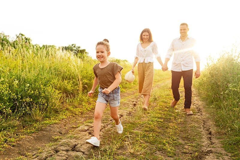 Family Walking In The Countryside